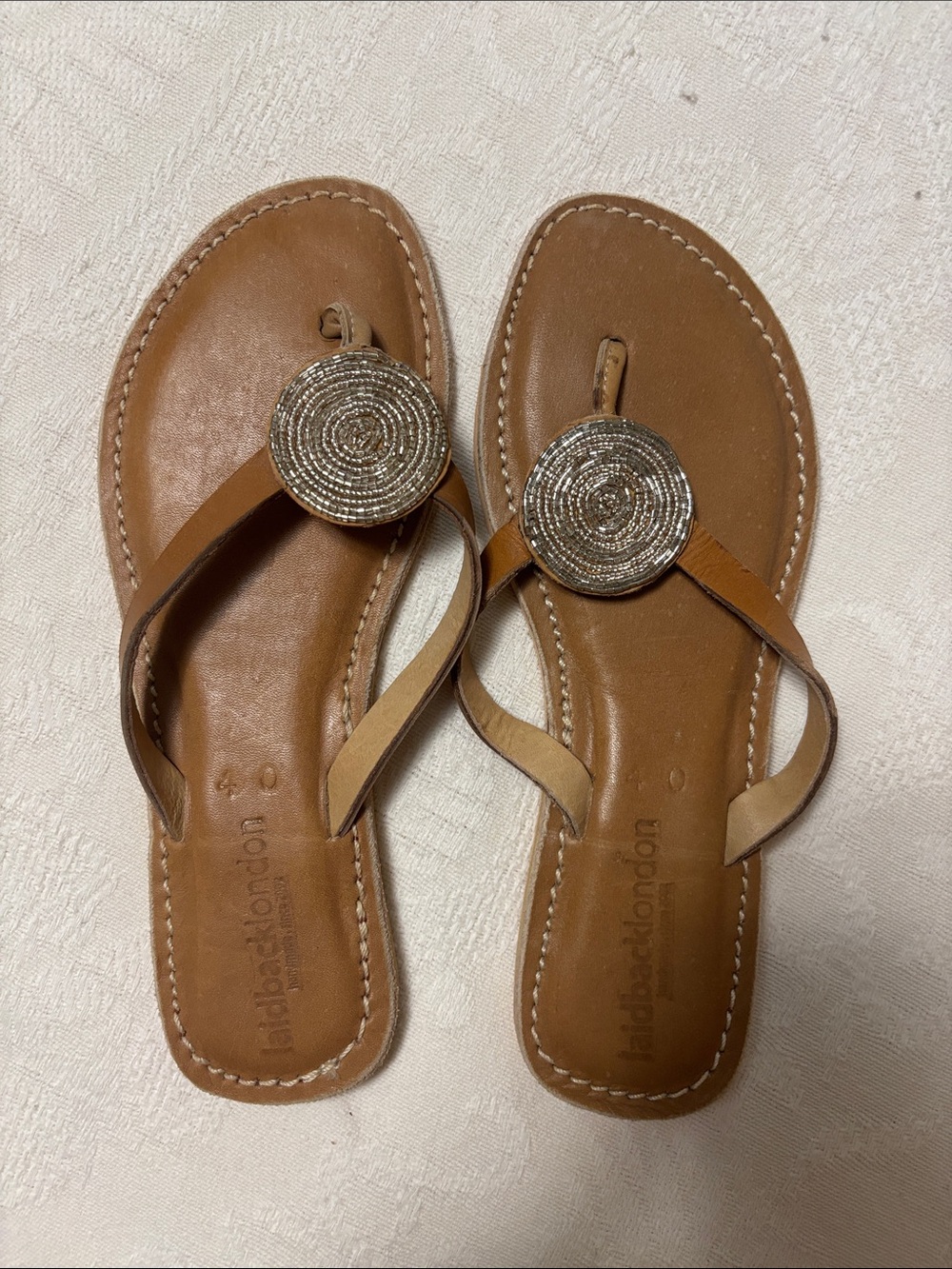 Women’s Tan Leather Beaded Thong Sandals with Metallic Medallion